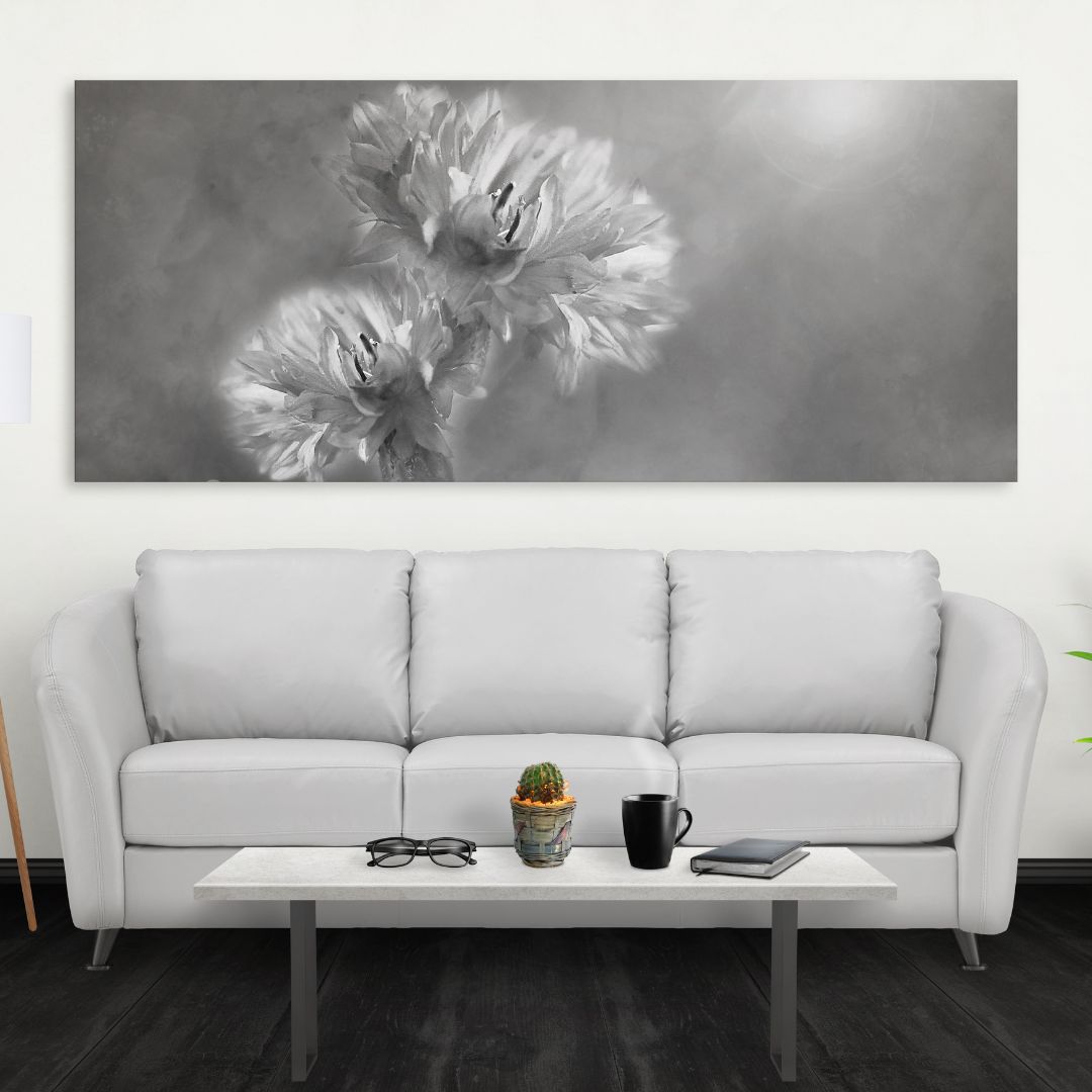 White couch with artwork above it