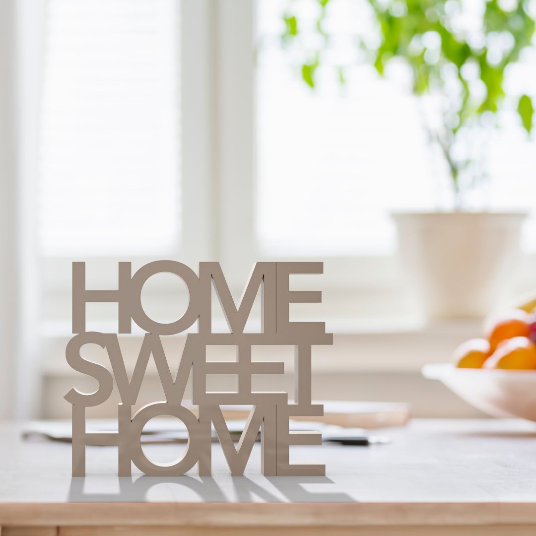 Table top with letters making the words "home sweet home"