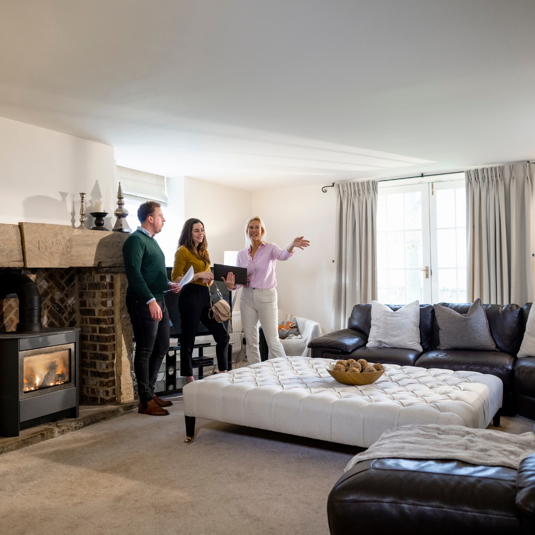 realtor walking couple through house