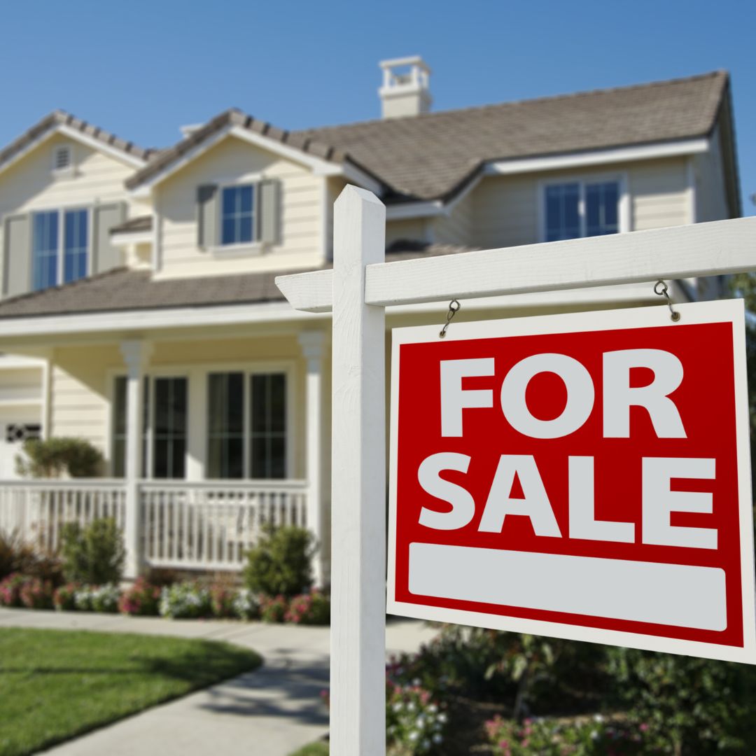 house with a for sale sign